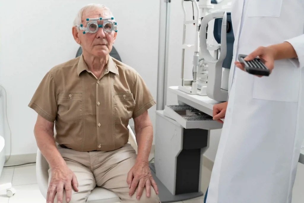 an old man checking his eye