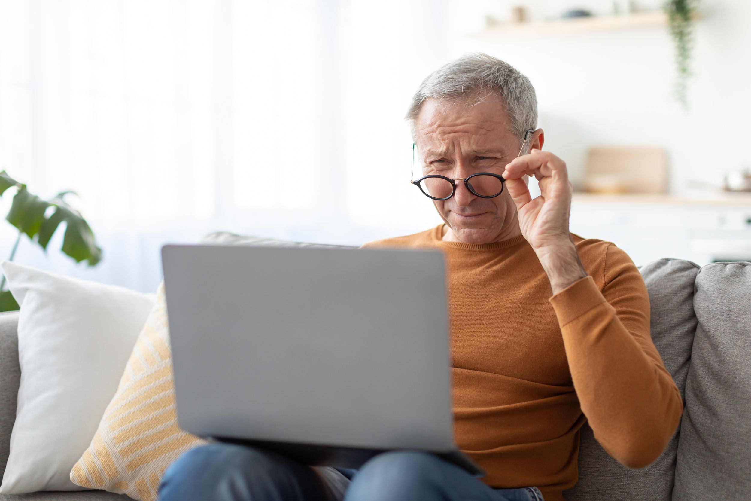 an old man with presbyopia