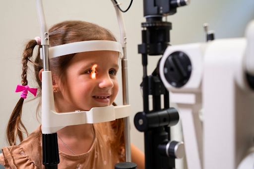 a girl is doing eye screening in her early age
