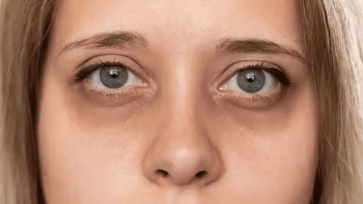 Woman's face with grey eyes looking at camera