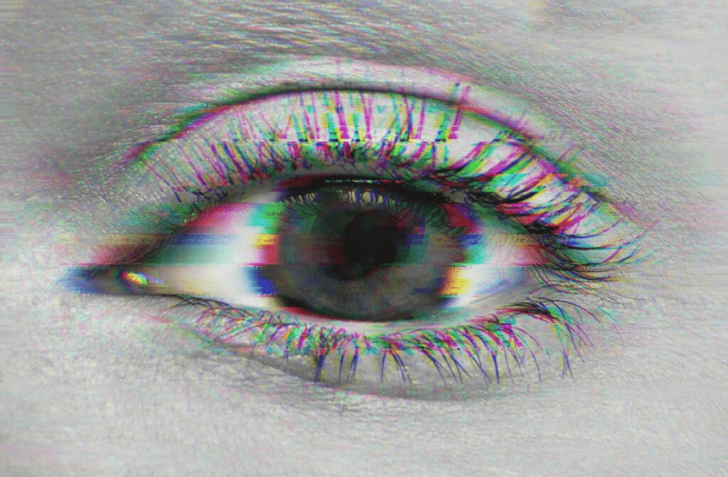 Close-up of an eye with a glitchy, distorted visual effect representing blurred vision.